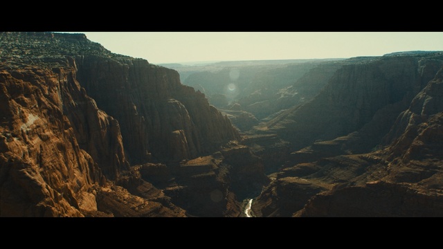 Video Reference: sky, rock, cliff, canyon, mountain, escarpment, atmosphere, terrain, highland, badlands