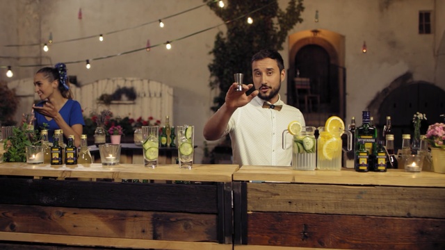 Video Reference: drink, distilled beverage, alcoholic beverage, liqueur, bar, alcohol, event, Person