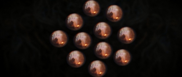 Video Reference: Sphere, Darkness, Thing, Black, Dark, Sitting, Small, Light, Wine, Board, Table, Bunch, Large, Night, Cutting, Room, Group, Red, Kitchen, Man, Standing, Purple, Bear, Christmas tree