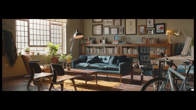 Video Reference: living room, furniture, room, table, home, dining room, interior design, window, real estate, couch, Person