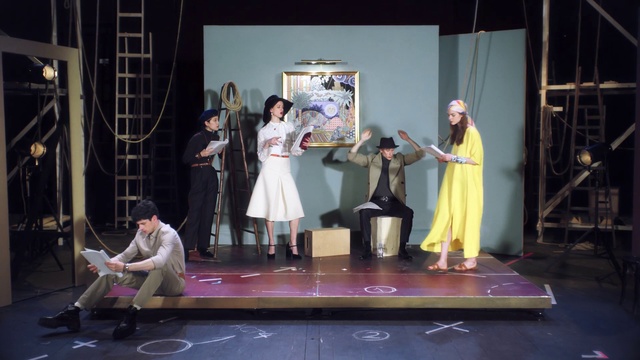 Video Reference: Stage, Performance, Heater, Drama, Performing arts, Performance art, Musical theatre, Scene, Musical, Event, Person, Indoor, Table, Playing, Room, Man, Standing, Woman, Holding, Living, People, Video, Game, Young, Group, Girl, Wooden, Computer, Wii, Display, Ball, Clothing, Dance, Dress, Concert, Footwear, Musical instrument