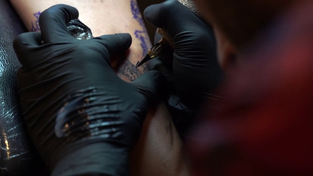 Video Reference: Tattoo, Leg, Footwear, Leather, Hand, Muscle, Textile, Finger, Shoe, Personal protective equipment