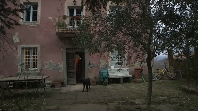 Video Reference: Neighbourhood, Residential area, Property, Town, Mode of transport, Wall, House, Facade, Street, Person