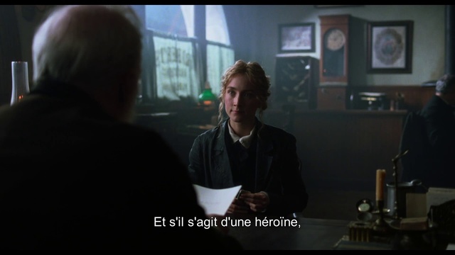 Video Reference: Conversation, Photo caption, Human, Interaction, Screenshot, Fun, Adaptation, Darkness, Photography, Space, Person, Indoor, Man, Looking, Sitting, Front, Table, Woman, Laptop, Holding, Standing, People, Using, Young, Computer, Group, Room, Phone, White, Human face, Clothing