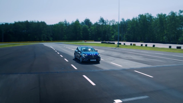 Video Reference: Land vehicle, Vehicle, Car, Road, Highway, Race track, Lane, Freeway, Asphalt, Performance car, Outdoor, Scene, Grass, Driving, Street, Traffic, Green, View, Stop, Red, White, Traveling, Riding, Yellow, City, Field, Sign, Tree, Sky, Way, Wheel, Text, Day