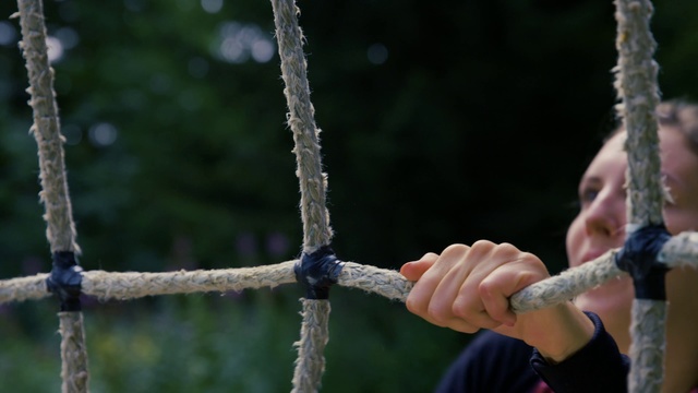 Video Reference: Water, Rope, Tree, Hand, Plant, Outdoor, Person, Holding, Player, Woman, Bat, Standing, Young, Bird, Man, Swinging, Ball, Wearing, White, Red, Blue, Playing, Branch, Baseball