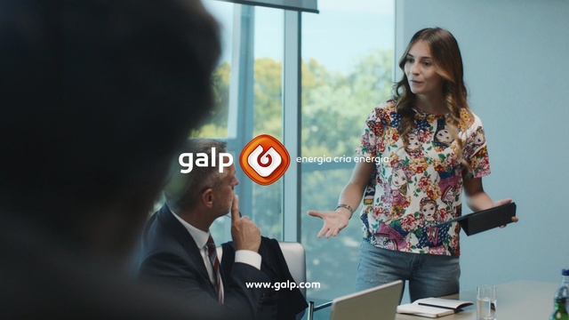 Video Reference: Adaptation, Job, Advertising, White-collar worker, Jacket, Businessperson, Person, Indoor, Woman, Looking, Standing, Front, Girl, Table, Mirror, Holding, Young, Man, Phone, Suit, Sign, Room, Human face, Clothing, Screenshot, Computer