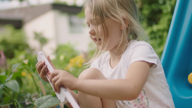 Video Reference: Child, Blond, Botany, Summer, Grass, Hand, Play, Technology, Adaptation, Plant