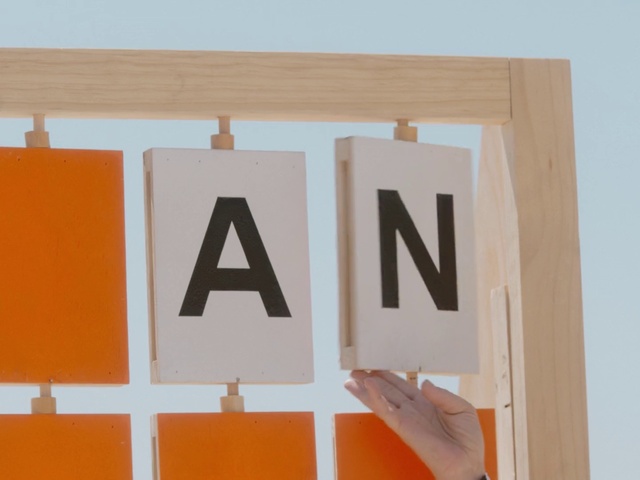 Video Reference: Orange, Font, Number, Room, Material property, Rectangle, Wood, Sign, Signage