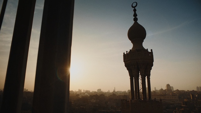 Video Reference: Landmark, Atmospheric phenomenon, Morning, Sky, Tower, Sunlight, Backlighting, Architecture, Photography, National historic landmark, Person