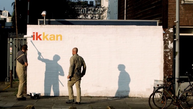 Video Reference: wall, street art, street, road, advertising, mural, vehicle, recreation, art, facade, Person