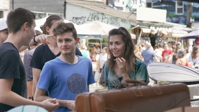 Video Reference: vehicle, tourism, city, product, street, girl, crowd, recreation, Person
