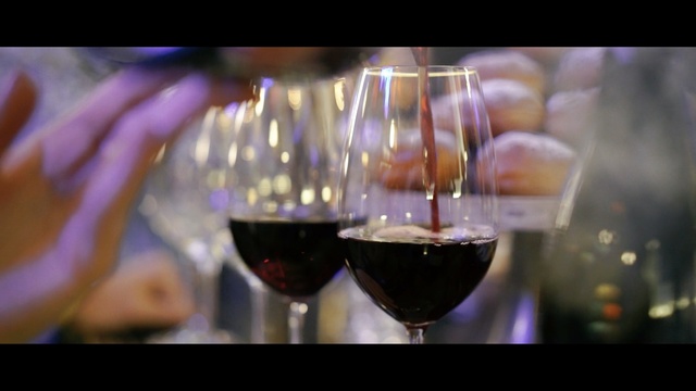 Video Reference: wine glass, stemware, drink, wine, red wine, alcoholic beverage, glass, purple, alcohol, champagne stemware, Person