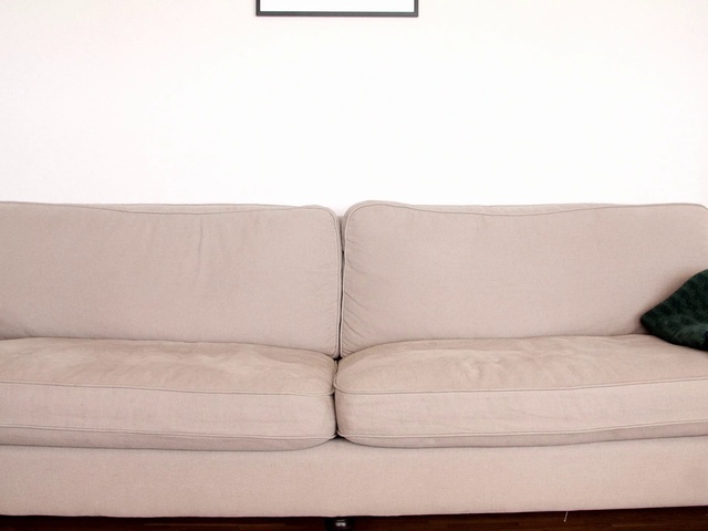 Video Reference: Furniture, Couch, Sofa bed, Beige, Room, studio couch, Slipcover, Floor, Comfort, Cushion