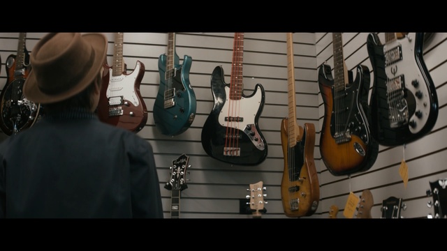 Video Reference: musical instrument, guitar, string instrument, plucked string instruments, string instrument, music, bass guitar, acoustic guitar, musician, musical instrument accessory, Person