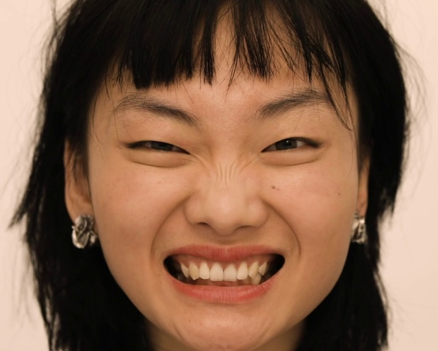 Video Reference: Face, Hair, Eyebrow, Tooth, Smile, Nose, Forehead, Facial expression, Chin, Hairstyle, Person