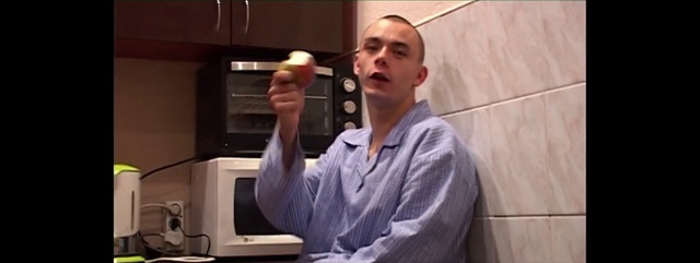 Video Reference: Technology, Room, Electronics, Electronic device, Home appliance, Microwave oven, Person, Cabinet, Indoor, Kitchen, Man, Front, Woman, Standing, Holding, Food, Oven, Wearing, Smiling, Microwave, White, Stove, Young, Cooking, Mirror, Computer, Human face, Laptop, Clothing