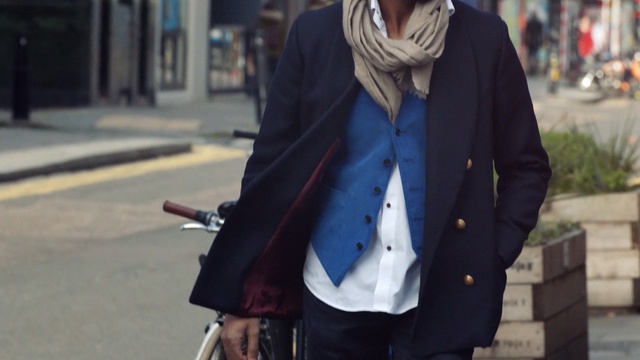 Video Reference: blazer, jeans, suit, infrastructure, road, snapshot, jacket, street, outerwear, gentleman, Person