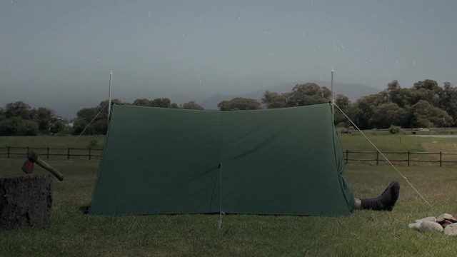 Video Reference: sky, tent, grass, rural area, field, pasture, tree, landscape, wind, vehicle