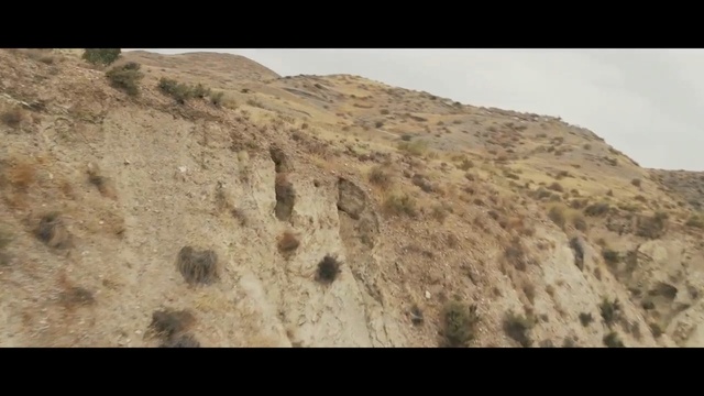 Video Reference: Rock, Outcrop, Bedrock, Geology, Formation, Soil, Terrain, Igneous rock, Geological phenomenon, Escarpment, Person