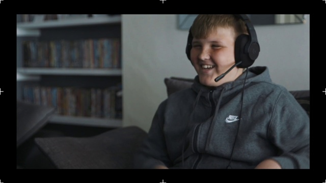 Video Reference: Photograph, Facial expression, Sitting, Snapshot, Outerwear, Cheek, Human, Smile, Photography, Jacket