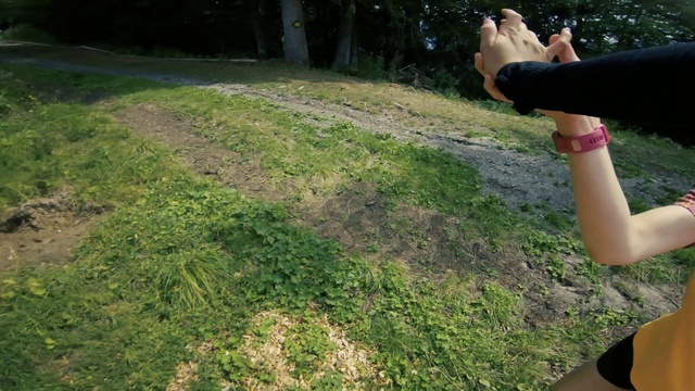 Video Reference: Grass, Lawn, Leaf, Soil, Plant, Tree, Hand, Shrub, Outdoor, Person, Young, Holding, Green, Standing, Man, Woman, Wearing, Shirt, Field, Street, Boy, Park, Girl, Yellow, Board, Phone, Baseball, Grassy, Ball, Bat, Hat, White, Riding, Hill, Player, Playing, Doing