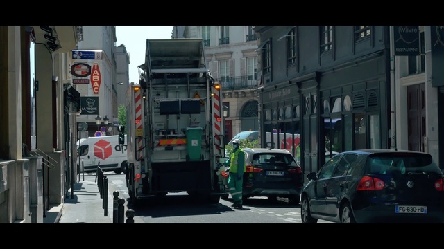 Video Reference: Motor vehicle, Mode of transport, Urban area, Transport, Vehicle, Street, Snapshot, Town, Metropolitan area, Traffic