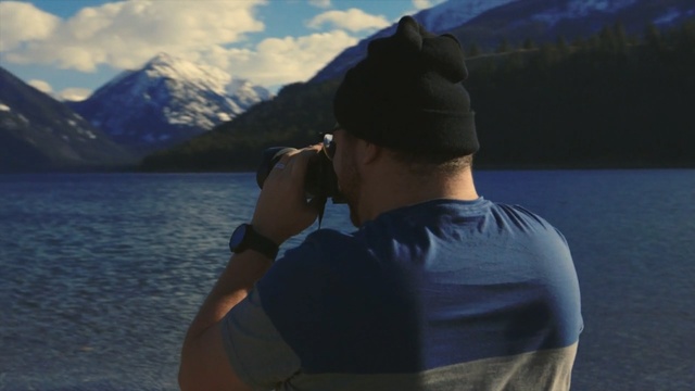 Video Reference: water, sky, mountainous landforms, vacation, lake, mountain, reflection, fjord, cloud, sea, Person