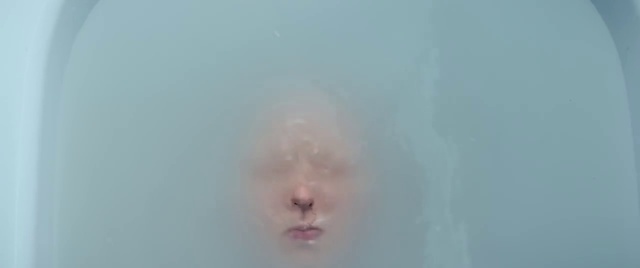 Video Reference: Face, Nose, Skin, Atmospheric phenomenon, Head, Cheek, Chin, Close-up, Pink, Water