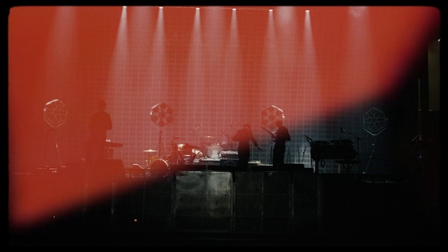 Video Reference: Red, Black, Stage, Light, Orange, Line, Font, Textile, Photography, Performance