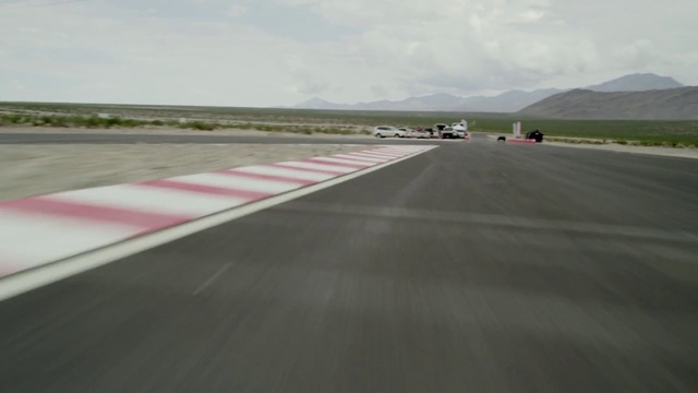Video Reference: Race track, Asphalt, Sport venue, Road, Line, Road surface, Runway, Infrastructure, Vehicle, Thoroughfare
