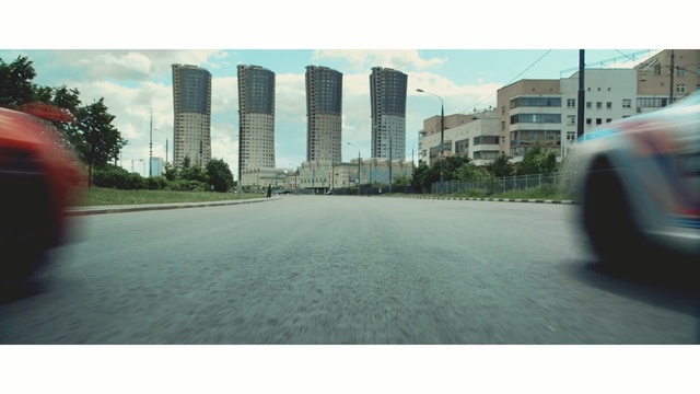 Video Reference: metropolitan area, road, city, vehicle, downtown, asphalt, sky, angle, building, urban design, Person