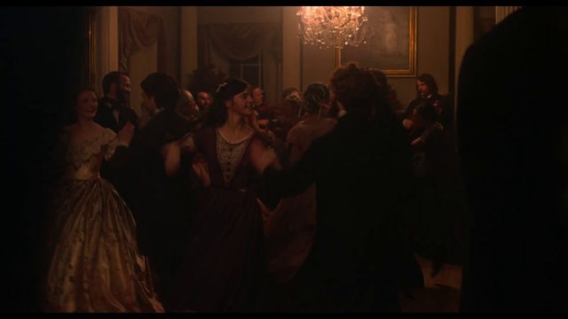 Video Reference: Photograph, Darkness, Crowd, Event, Lady, Fun, Fashion, Audience, Photography, Ceremony, Person, Indoor, Standing, Man, People, Dark, Looking, Front, Group, Photo, Lit, Room, Holding, Woman, Mirror, Screen, Light, Video, Large, Door, Playing, Phone, Table, Dance, Wedding dress, Clothing, Dress, Bride
