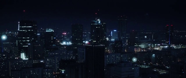 Video Reference: Cityscape, City, Metropolitan area, Metropolis, Urban area, Night, Skyline, Skyscraper, Human settlement, Downtown, Outdoor, Building, Light, Dark, Street, View, Large, Sitting, Traffic, Lit, Standing, Snow, White, Driving, Tower, Tall, Red, Sign, Computer, Sky
