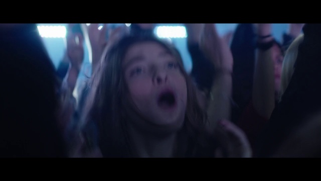 Video Reference: Face, People, Fun, Lady, Snapshot, Fiction, Mouth, Human, Interaction, Scene, Person, Television, Monitor, Screen, Indoor, Photo, Man, Looking, Watching, Front, Sitting, Close, Holding, Dark, Blurry, Room, Video, Mirror, Living, Woman, Remote, Train, Screenshot, Human face, Girl, Image