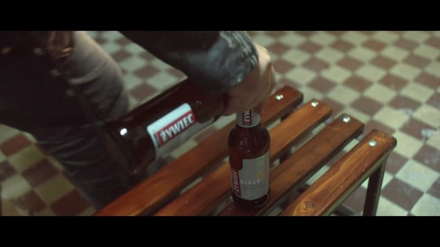 Video Reference: Bottle, Drink, Liqueur, Wood, Alcohol, Glass bottle, Table, Footwear, Wood stain, Shoe
