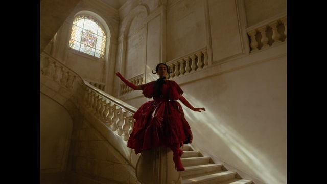 Video Reference: Red, Dress, Lady, Fashion, Stock photography, Architecture, Window, Gown, Art, Column, Person