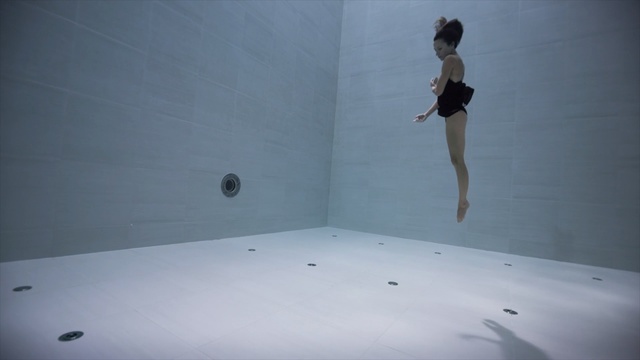Video Reference: wall, floor, bathtub, flooring, sky, water, angle, recreation, space, Person