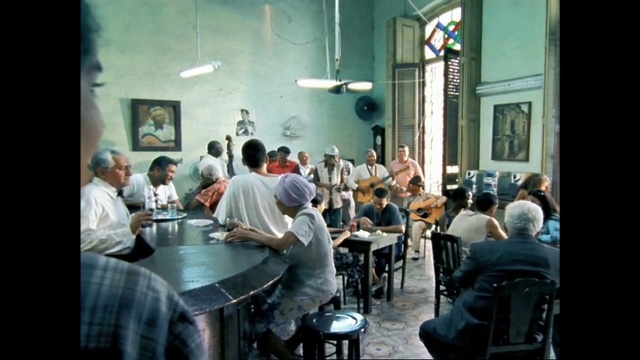 Video Reference: Room, Conversation, Sitting, Restaurant, Event, Table, Building, Person