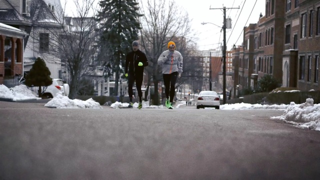 Video Reference: snow, winter, neighbourhood, lane, town, freezing, urban area, residential area, street, tree, Person