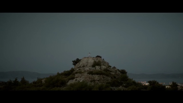 Video Reference: sky, atmosphere, tree, hill, highland, terrain, mountain, darkness, rock, landscape