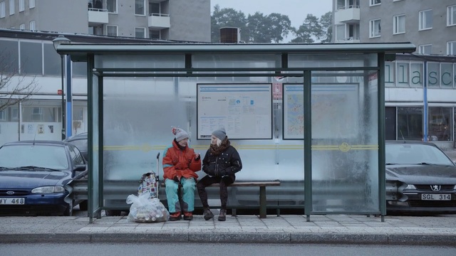 Video Reference: car, land vehicle, public space, bus stop, vehicle, city, transport, motor vehicle, winter, snow, Person