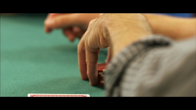 Video Reference: games, hand, finger, sitting, poker, arm, indoor games and sports, leg, nail, gambling, Person