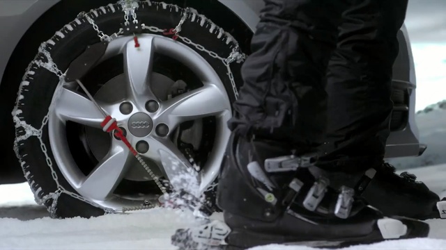 Video Reference: tire, automotive tire, wheel, motor vehicle, footwear, mode of transport, rim, snow, alloy wheel, spoke, Person