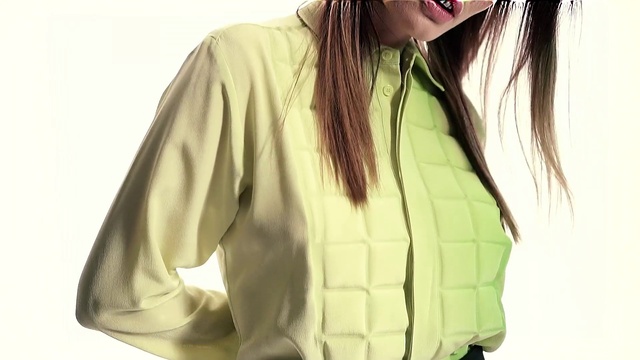 Video Reference: White, Clothing, Green, Yellow, Outerwear, Long hair, Jacket, Sleeve, Blouse, Beige
