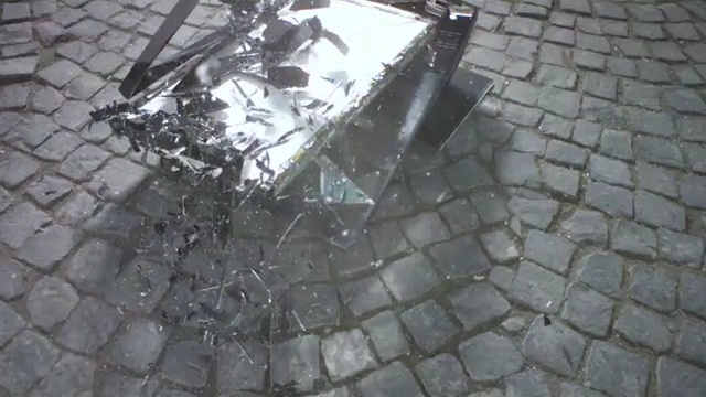 Video Reference: asphalt, cobblestone, road surface, metal, outdoor structure, automotive tire, tree