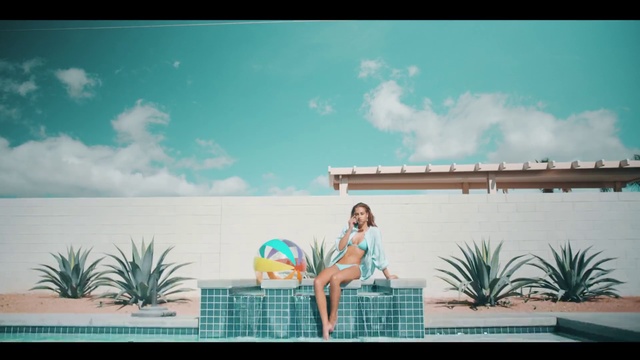 Video Reference: Vacation, Aqua, Turquoise, Summer, Leisure, Palm tree, Tree, Arecales, Travel, Plant, Front, Man, Holding, Small, Woman, Green, Sign, Board, Standing, Large, Young, Colorful, Girl, White, Palm, Beach, Table, Blue, Surfing, Water, Air, Riding, Ball, Bed, Text, Sky, Cartoon, Cloud