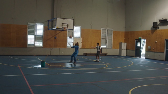 Video Reference: sport venue, basketball court, sports, structure, floor, leisure centre, flooring, net, indoor games and sports, hardwood, Person