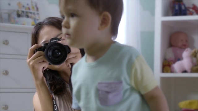 Video Reference: Photograph, Camera, Child, Cameras & optics, Photographer, Skin, Cheek, Snapshot, Digital camera, Photography