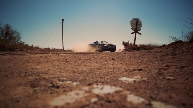 Video Reference: Sky, Off-roading, Road, Vehicle, Dirt road, Landscape, Dust, Automotive tire, Off-road racing, Soil